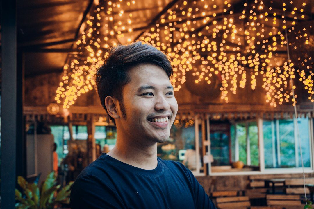 Professional portrait of a smiling man in a modern office