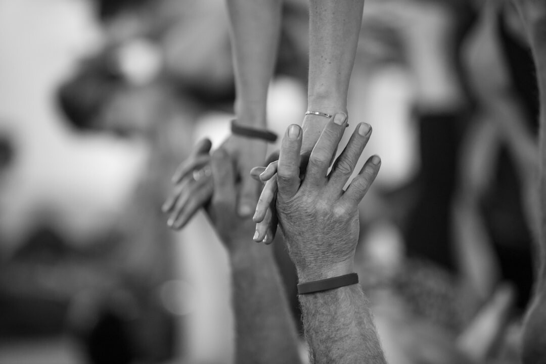 Diverse group of coworkers celebrating together with a high five